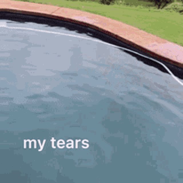 a swimming pool with the words " my tears " on the bottom