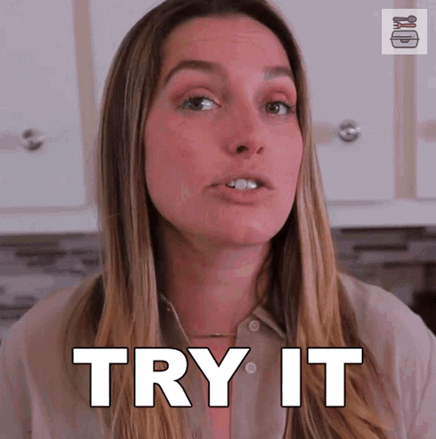 a woman says try it in front of a kitchen cabinet