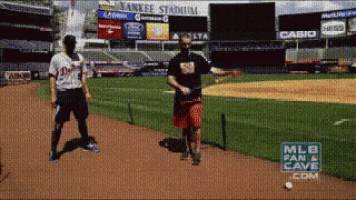 a man throws a baseball at a yankee stadium
