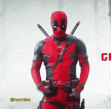 a man in a deadpool costume is standing in front of a sign that says g.i.