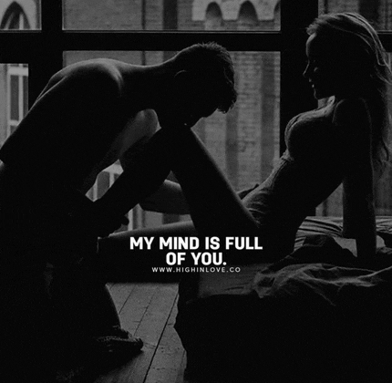 a black and white photo of a man kissing a woman 's leg with a caption that says " my mind is full of you "