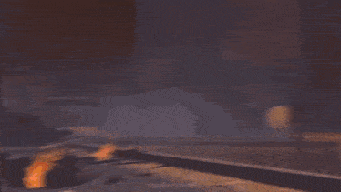 a star shaped structure is lit up at night and looks like it is exploding