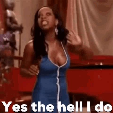 a woman in a blue dress is standing in front of a red curtain and says yes the hell i do .