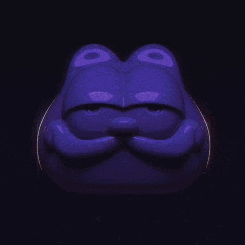 a green frog is glowing in the dark with a dark background