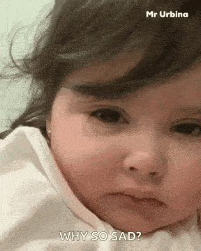 a little girl is making a sad face and asking why so sad .