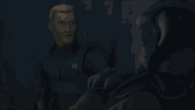 a man is holding another man 's hand in the dark