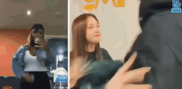a woman in a white tank top is dancing in a room next to a man in a black jacket .