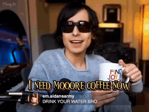 a man holding a coffee mug that says find joy in life
