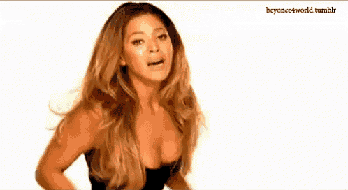 a woman in a black dress is making a surprised face .