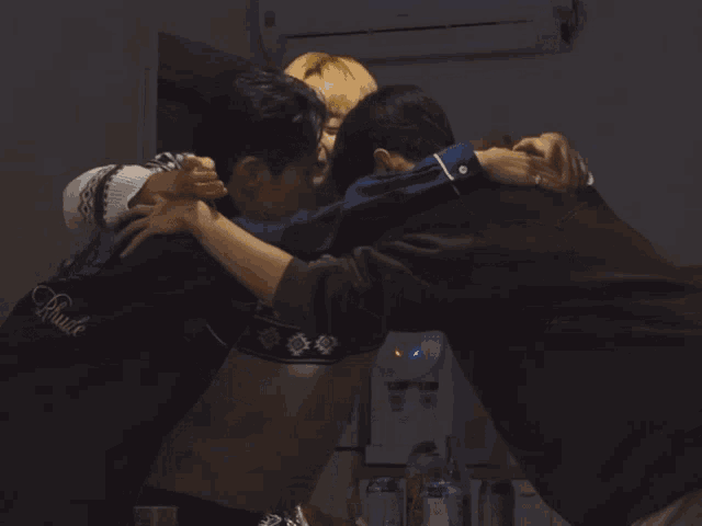 two men hugging with one wearing a jacket that says rude on it