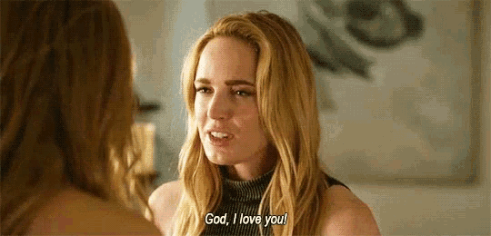a woman with long blonde hair is talking to another woman and saying `` god , i love you '' .