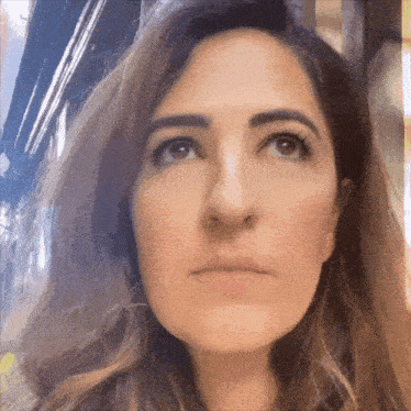 a woman with a serious look on her face