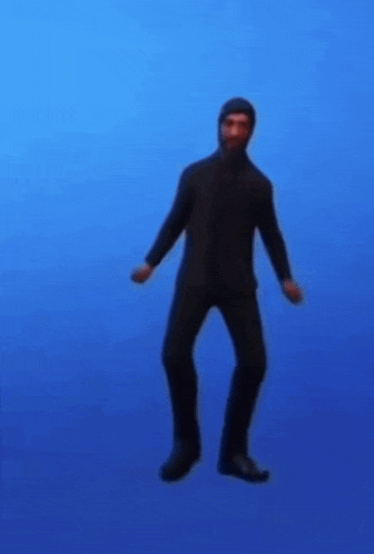 a man in a black suit is dancing in front of a blue background .