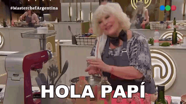 a woman in a kitchen with the words hola papi written on the bottom