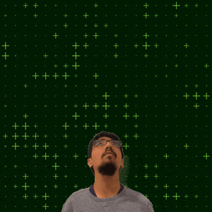 a man with glasses stands in front of a green background with the number 10 on it