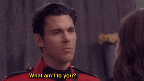 a woman says you 're my lobster to a man in a red uniform