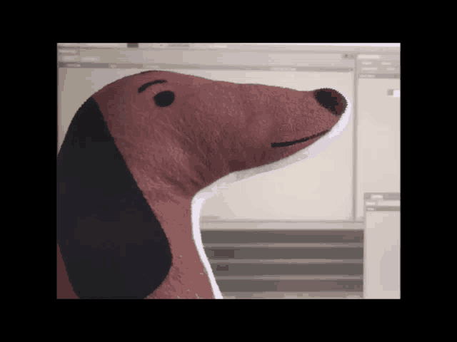 a stuffed dachshund with a black nose and black eyes