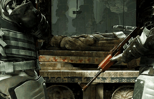 a man holding a gun in front of a statue with a cross on it