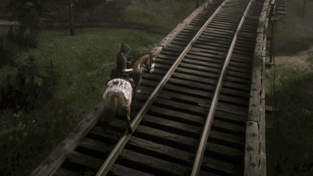 a person riding a horse on train tracks in a video game
