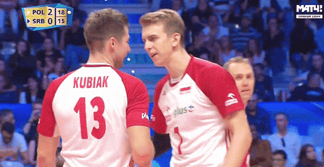 two volleyball players one with the number 13 on his back