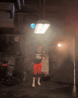 a football player wearing a jersey with the number 95 on it