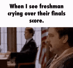 a man with a mustache is sitting in a chair and crying over his finals score .