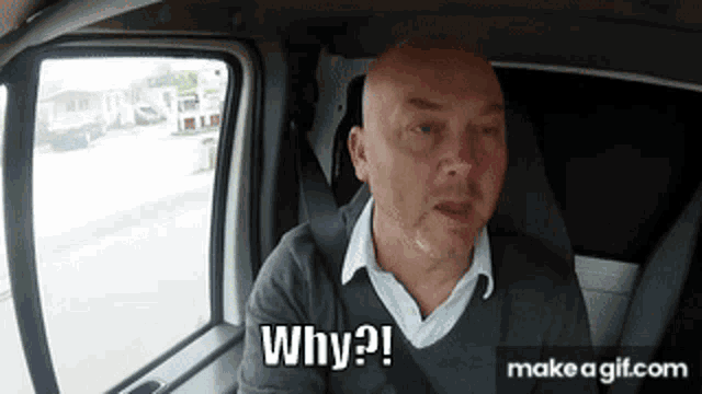a bald man is sitting in the back seat of a car asking why