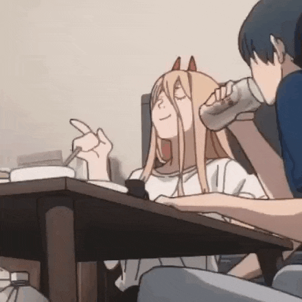 a man and a woman are sitting at a table . the woman is drinking from a can .