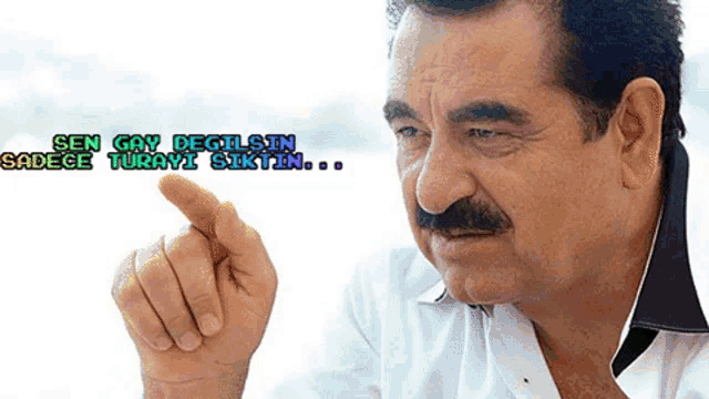 a man with a mustache is pointing at something with the words sen gay degilsin sadece turavi siktin written above him
