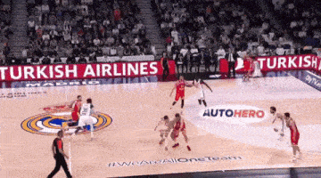 a basketball game is being played in a stadium with advertisements for turkish airlines and autohero