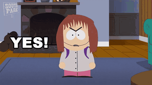 a girl from south park says yes in front of a fireplace