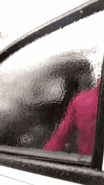 a close up of a car window that is covered in ice