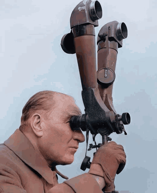a man is looking through a telescope with the letter o on the lens