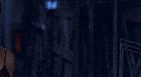 a close up of a woman 's face with a blurred background