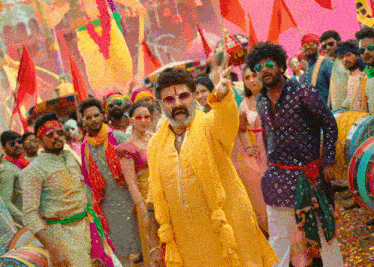 a man in a yellow outfit is standing in front of a crowd