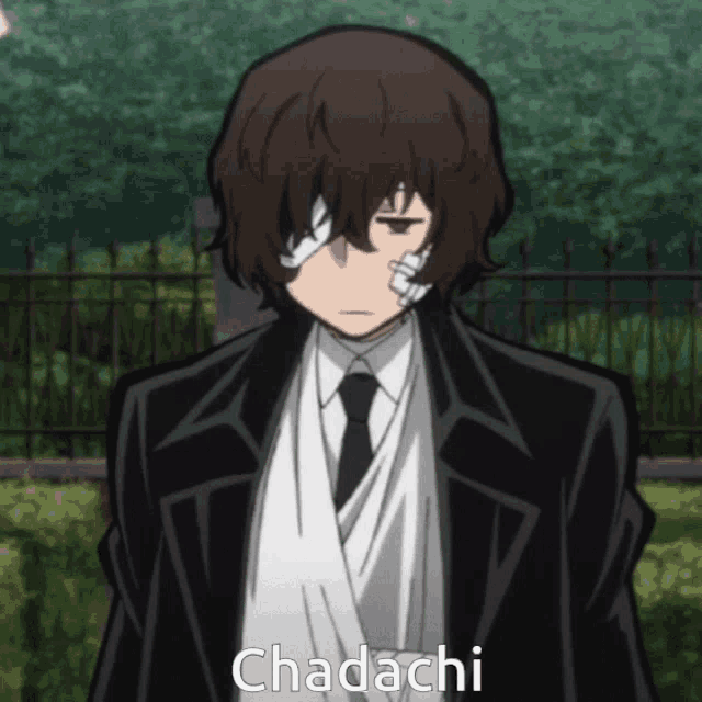 a man in a suit and tie with a bandage on his eye and the word chadachi above him
