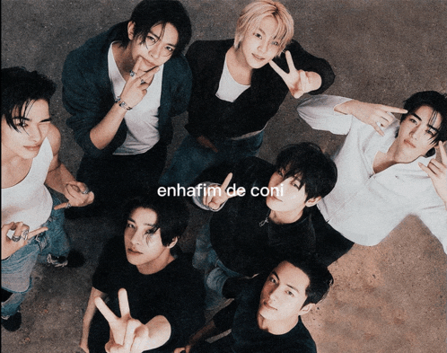 a group of young men are posing for a picture with the words enhafim de coni on the bottom left