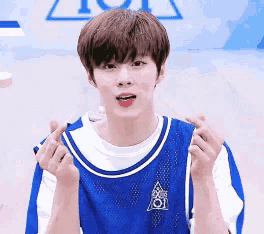 a young man wearing a blue and white jersey with the number 101 on it
