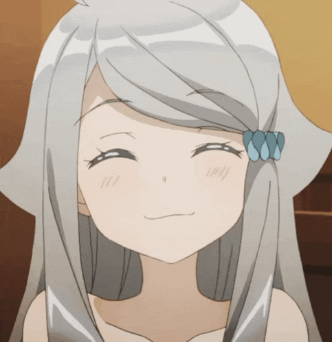 a girl with gray hair and a blue bow in her hair smiles