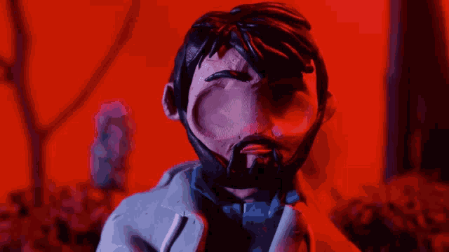 a clay figure of a man with a beard and glasses