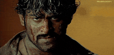 a close up of a man 's face with the words prabhasgifs written on the bottom