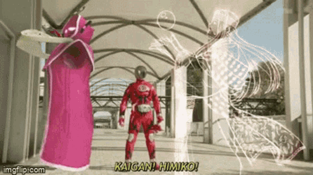 a man in a red suit is standing next to a woman in a pink cape and says kaigan himiko