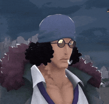 a man wearing a blue hat and glasses stands in front of a mountain