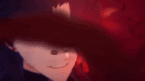 a close up of a person 's face with glowing eyes and a red background .