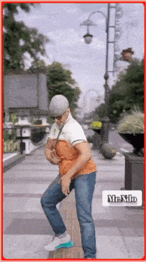 a man wearing a hat and sunglasses is dancing on a sidewalk with a mr. niko logo in the corner