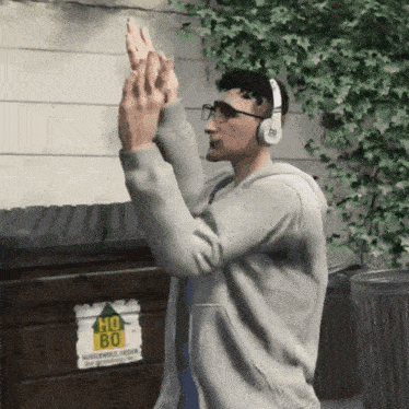 a man wearing headphones stands in front of a sign that says ho 80