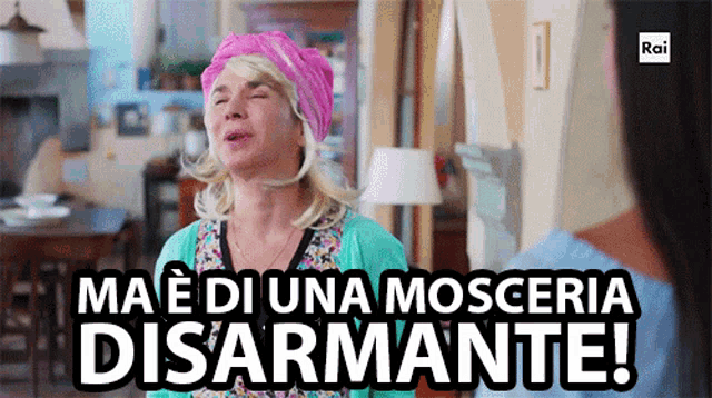 a woman wearing a pink turban says ma e di una mosseria disarmante