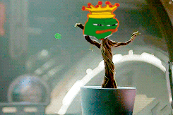a potted plant with a drawing of a tree with a crown on its head