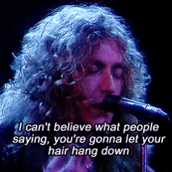 a man with curly hair singing into a microphone with the words i can t believe what people saying