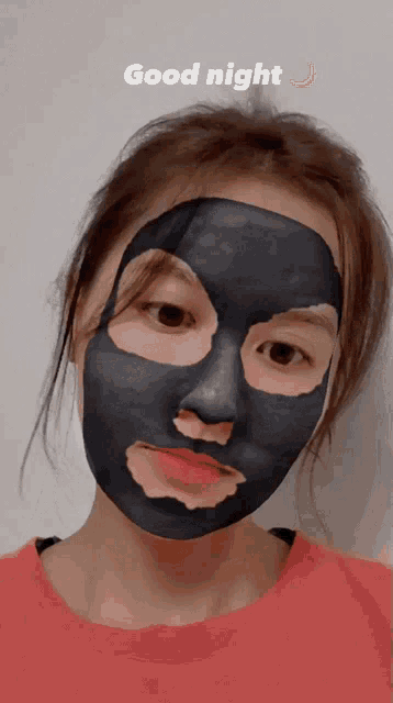 a woman with a black mask on her face and the words good night above her